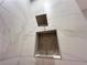 Modern shower with large marble-style tile, shower niche, and rainfall shower head at 1021 Liberty Springs Dr, Woodstock, GA 30188