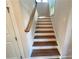 Staircase with hardwood steps and white risers leading to the second floor at 1021 Liberty Springs Dr, Woodstock, GA 30188