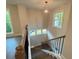 Staircase with hardwood steps, white risers, and natural light at 1021 Liberty Springs Dr, Woodstock, GA 30188