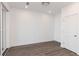 Bright bedroom with neutral walls, wood floors, and large windows allowing for natural light at 111 Iveybrooke Ln # 60, Alpharetta, GA 30009
