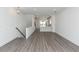 Open-concept living room with hardwood floors connecting to a modern kitchen, perfect for entertaining at 111 Iveybrooke Ln # 60, Alpharetta, GA 30009