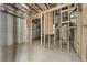 Unfinished basement featuring visible framework, concrete walls, and exposed ceiling with utilities at 117 Owens Mill Pl, Canton, GA 30115