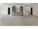 Open basement space featuring built in cabinets, staircase, and neutral paint at 117 Owens Mill Pl, Canton, GA 30115