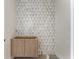 Stylish bathroom design with a unique patterned wall and a modern vanity cabinet at 117 Owens Mill Pl, Canton, GA 30115