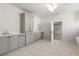 Elegant bathroom features double vanity, plenty of cabinet space, and modern light fixtures at 117 Owens Mill Pl, Canton, GA 30115