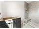 Bathroom features stylish vanity cabinets, tiled shower, and a modern design at 117 Owens Mill Pl, Canton, GA 30115