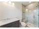 Bathroom showcasing walk-in shower with glass door, gray cabinets, and modern finishes at 117 Owens Mill Pl, Canton, GA 30115