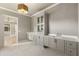 Elegant bathroom with dual vanities, modern lighting, and cabinetry at 117 Owens Mill Pl, Canton, GA 30115