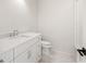 Modern bathroom with white vanity, marble countertop, and tiled shower at 117 Owens Mill Pl, Canton, GA 30115
