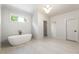 Elegant bathroom with a freestanding tub, modern fixtures, and a glass-enclosed shower at 117 Owens Mill Pl, Canton, GA 30115
