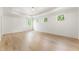 Bright and spacious primary bedroom with hardwood floors, large windows and tray ceiling at 117 Owens Mill Pl, Canton, GA 30115