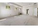 Unfinished bedroom with multiple windows and a doorway leading to an adjacent room at 117 Owens Mill Pl, Canton, GA 30115