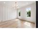 Cozy bedroom with hardwood floors, modern lighting fixture, and two bright windows at 117 Owens Mill Pl, Canton, GA 30115