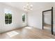 Bright bedroom with hardwood floors, black trim window frames and modern lighting at 117 Owens Mill Pl, Canton, GA 30115