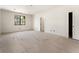 Unfinished bedroom featuring dark-trimmed windows and a doorway to an adjacent room at 117 Owens Mill Pl, Canton, GA 30115
