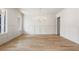 Spacious dining room with bright natural light, sleek hardwood floors and paneled walls at 117 Owens Mill Pl, Canton, GA 30115