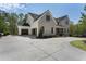 New construction boasting a large driveway, modern brick design, and black windows at 117 Owens Mill Pl, Canton, GA 30115