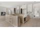 Unfinished kitchen with a light wood center island and stainless steel farmhouse sink at 117 Owens Mill Pl, Canton, GA 30115