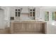 Bright kitchen featuring custom cabinets and unfinished central island and flooring at 117 Owens Mill Pl, Canton, GA 30115