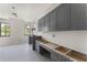 Large kitchen with custom gray cabinets, stainless fixtures, and ample counter space at 117 Owens Mill Pl, Canton, GA 30115