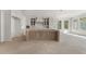 Spacious kitchen with unfinished floors and custom cabinets with a light wood center island at 117 Owens Mill Pl, Canton, GA 30115