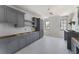 New kitchen features custom gray cabinets, stainless fixtures, and tile flooring at 117 Owens Mill Pl, Canton, GA 30115