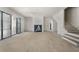 Unfinished living room featuring sliding glass doors, stairs to second story, and fireplace at 117 Owens Mill Pl, Canton, GA 30115