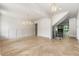 Bright and airy living room featuring light hardwood floors, modern lighting, and paneled walls at 117 Owens Mill Pl, Canton, GA 30115