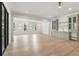 Bright living room features light wood floors, recessed lighting and large built-in cabinet with sink and plenty of storage at 117 Owens Mill Pl, Canton, GA 30115