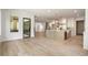 Open-concept living area featuring hardwood floors and a modern kitchen with island at 117 Owens Mill Pl, Canton, GA 30115