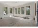 Unfinished Living Room with large window views and premium trim work at 117 Owens Mill Pl, Canton, GA 30115
