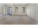 Unfinished living space with large windows, wainscoting, and a modern doorframe for future customization at 117 Owens Mill Pl, Canton, GA 30115