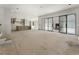 A modern open concept living space with kitchen island and sliding glass doors leading to other rooms at 117 Owens Mill Pl, Canton, GA 30115