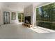 Outdoor living space with fireplace, railing, and natural views at 117 Owens Mill Pl, Canton, GA 30115
