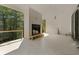 Covered outdoor living space with a fireplace and view of surrounding trees at 117 Owens Mill Pl, Canton, GA 30115