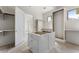 Large walk-in pantry with custom shelving, drawers, and cabinets, awaiting your personal design touches at 117 Owens Mill Pl, Canton, GA 30115