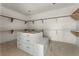 Unfinished pantry featuring open shelving and an island with drawers at 117 Owens Mill Pl, Canton, GA 30115
