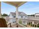Enjoy stunning views from this home's balcony, showcasing the neighborhood and blue skies at 2004 Haley Walk, Woodstock, GA 30188