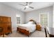 Bedroom with windows, ceiling fan, carpet, bed, and dresser at 2004 Haley Walk, Woodstock, GA 30188