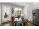 Bright breakfast nook with natural light, a cozy dining table, and stainless steel refrigerator at 2004 Haley Walk, Woodstock, GA 30188