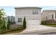 Charming home exterior featuring a well-maintained yard, two car garage, and tasteful landscaping at 2004 Haley Walk, Woodstock, GA 30188