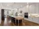 Expansive kitchen featuring a large island, modern appliances, and ample cabinet space at 2004 Haley Walk, Woodstock, GA 30188