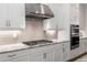 Modern kitchen featuring sleek white cabinets, granite countertops, and stainless steel appliances at 2004 Haley Walk, Woodstock, GA 30188