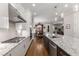 Well-equipped kitchen with a center island, stainless steel appliances, and a seamless connection to the dining area at 2004 Haley Walk, Woodstock, GA 30188