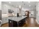 Bright, spacious kitchen features a large island with seating, granite countertops, and stainless steel appliances at 2004 Haley Walk, Woodstock, GA 30188