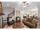Inviting living room features a fireplace, hardwood floors, neutral paint colors and comfortable seating at 2004 Haley Walk, Woodstock, GA 30188