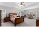 Main bedroom features a tray ceiling, windows, furniture and carpet at 2004 Haley Walk, Woodstock, GA 30188