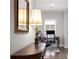 Bright and airy office space featuring vintage desk, ornate lamp, and neutral walls with a large framed mirror at 2004 Haley Walk, Woodstock, GA 30188