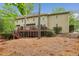 Exterior of home with large backyard and multi-level deck, ideal for outdoor living at 700 Winterwind Way, Roswell, GA 30075