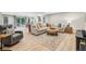 Finished basement with a large sectional sofa and a walkout to the backyard at 700 Winterwind Way, Roswell, GA 30075